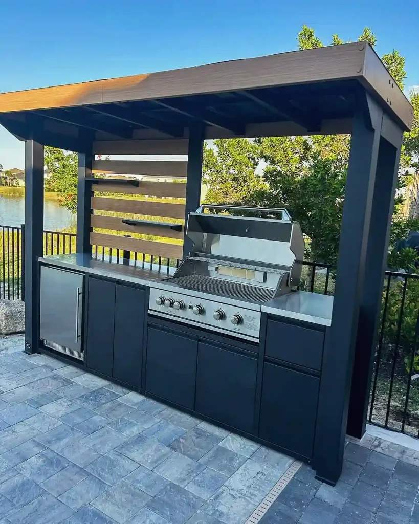 Slimline modern outdoor kitchen with wood pergola