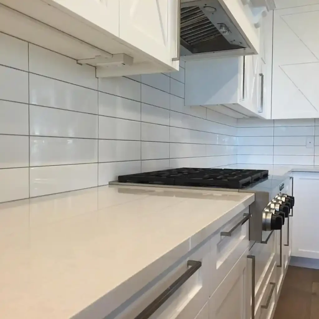 Clean & Minimal White Kitchen with Linear Backsplash Detail