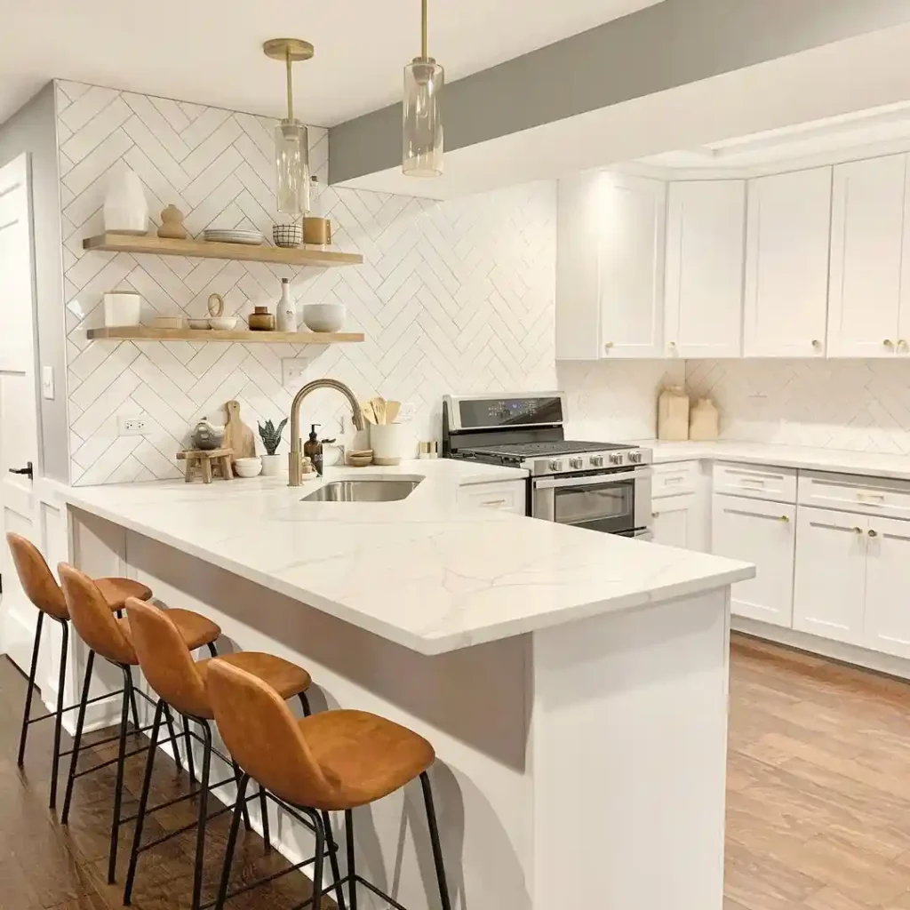  White Kitchen with Waterfall Island and Textured Backsplash