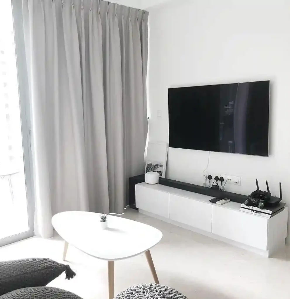Clean White Minimalist Living Room with Tech-Friendly Setup