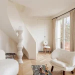 Creamy Minimalist Living Room with Sculptural Pieces