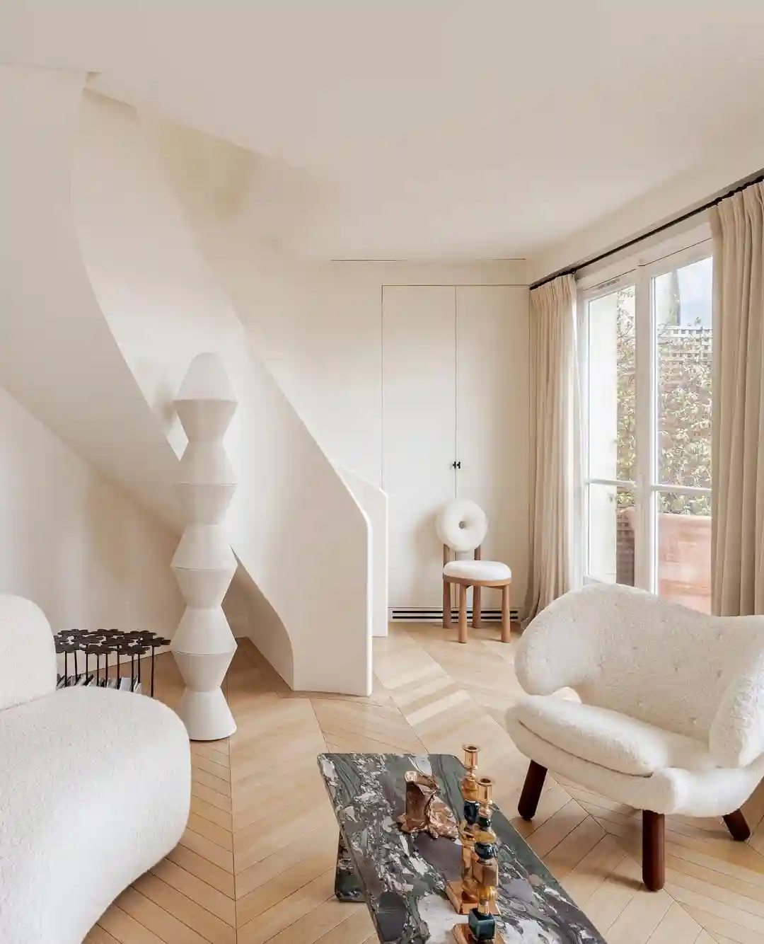 Creamy Minimalist Living Room with Sculptural Pieces