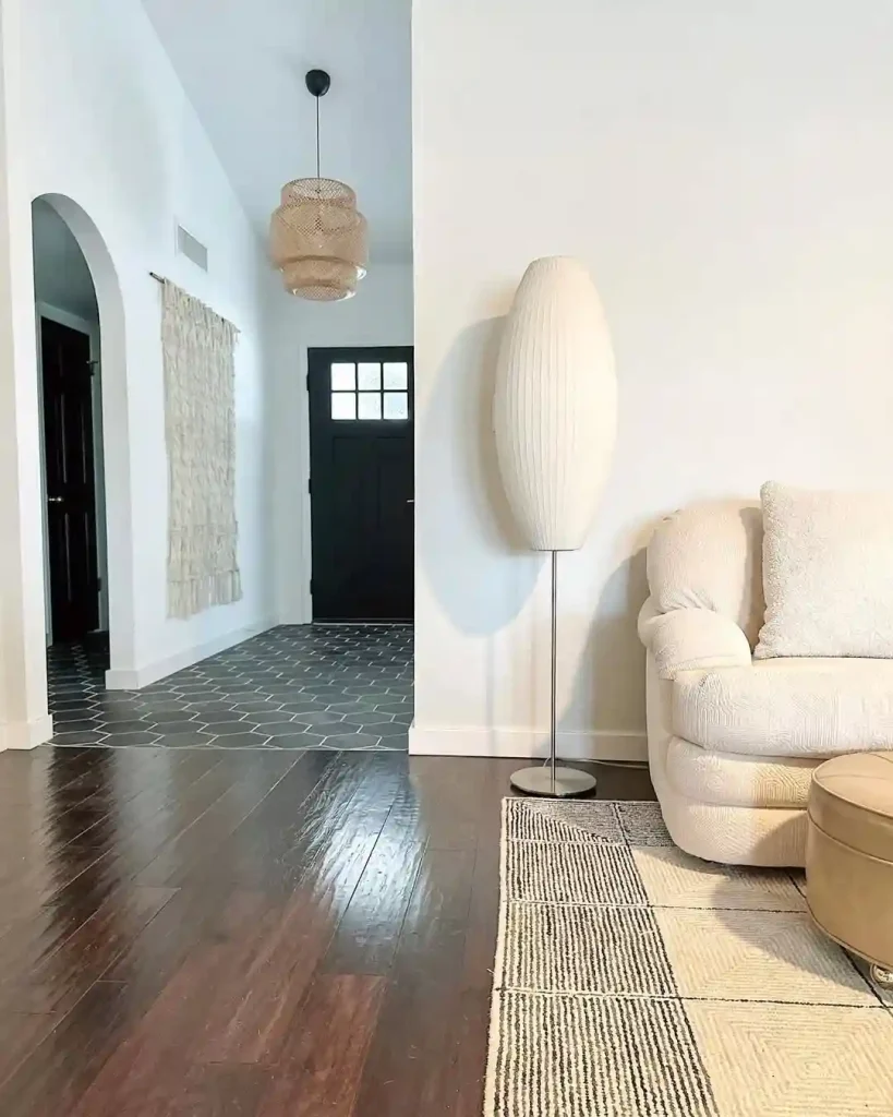 Entryway-Adjacent Minimalist Living Room with Soft Lighting