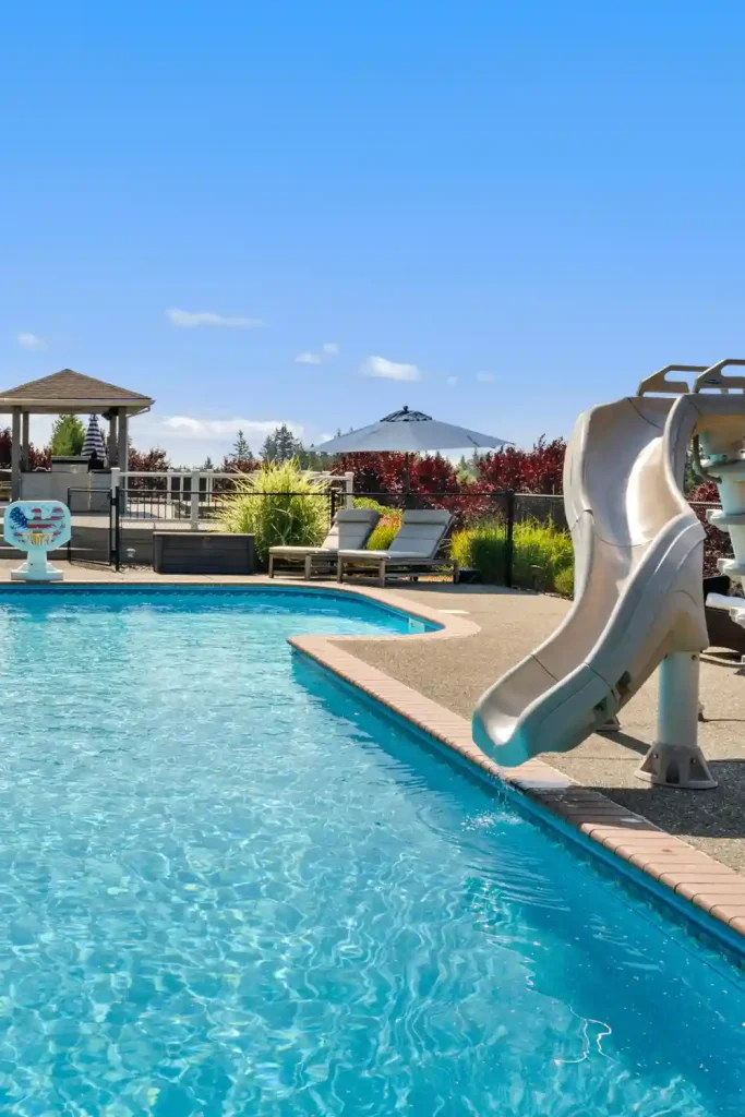 Family-Friendly Pool with Slide and Sun Loungers