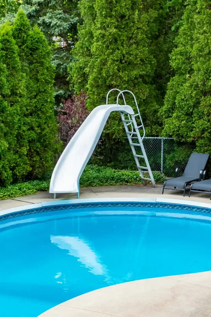 Round Pool with Slide and Evergreen Privacy