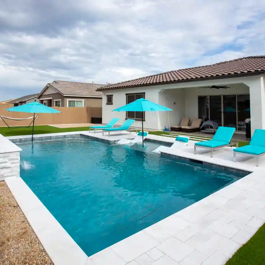 Vibrant Poolside with Turquoise Umbrellas and Loungers